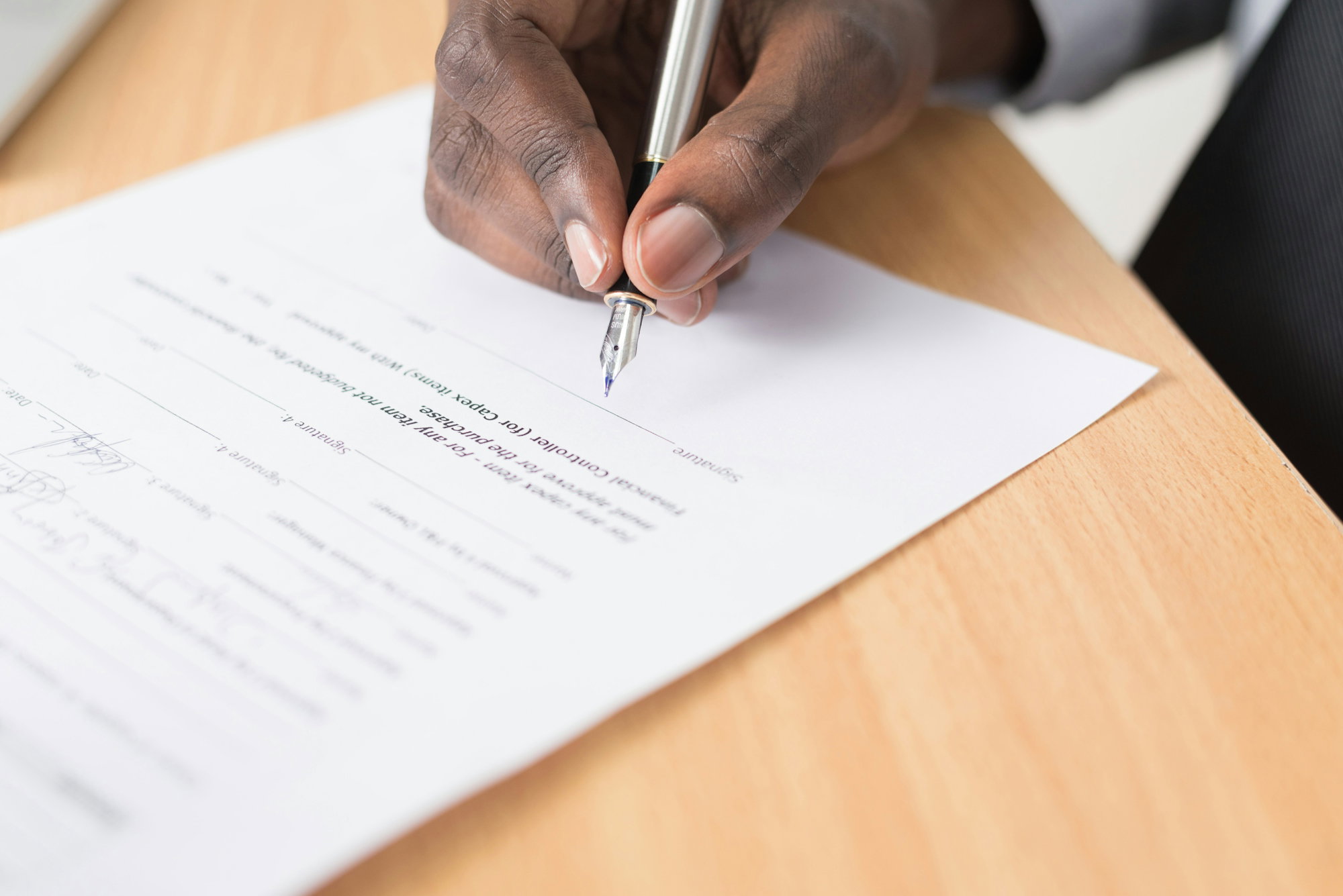 person-writing-on-white-paper.jpg person writing on white paper